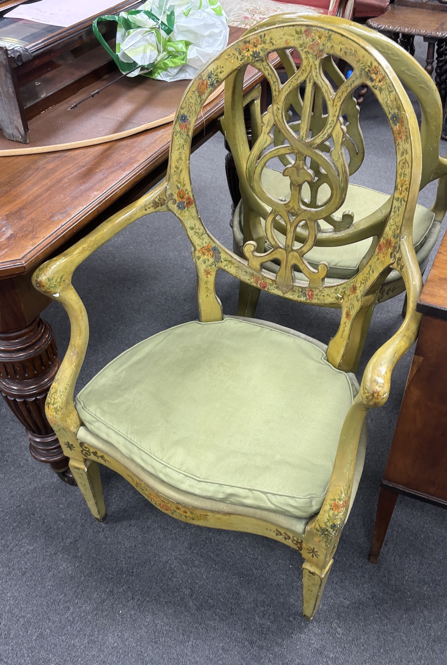 A set of four late 18th century Continental green painted elbow chairs, width 62cm, depth 50cm, height 100cm